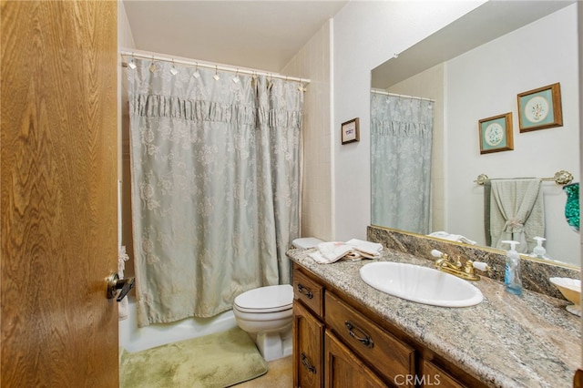 bathroom with toilet, shower / bath combination with curtain, and vanity