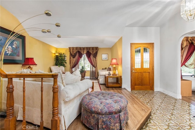 living area featuring baseboards
