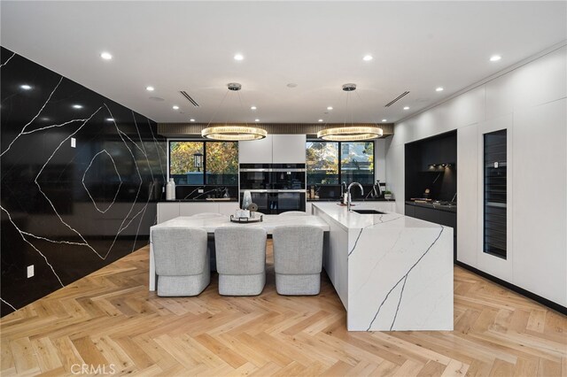38221/2 Laurel Canyon Blvd, Studio City, CA 91604 - kitchen with modern cabinets, a large island, a sink, recessed lighting, and plenty of natural light