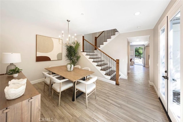 107 Plaza Via Sol, San Clemente, CA 92673 - dining area featuring stairs, a chandelier, baseboards, light wood-style floors, and recessed lighting