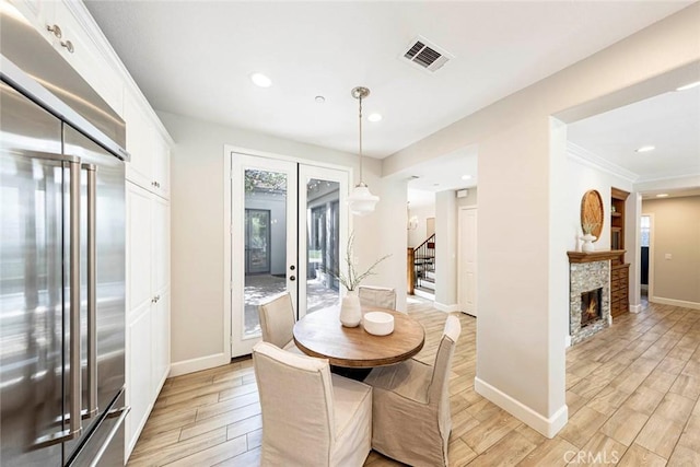 107 Plaza Via Sol, San Clemente, CA 92673 - dining space with stairway, light wood finished floors, recessed lighting, baseboards, and a fireplace