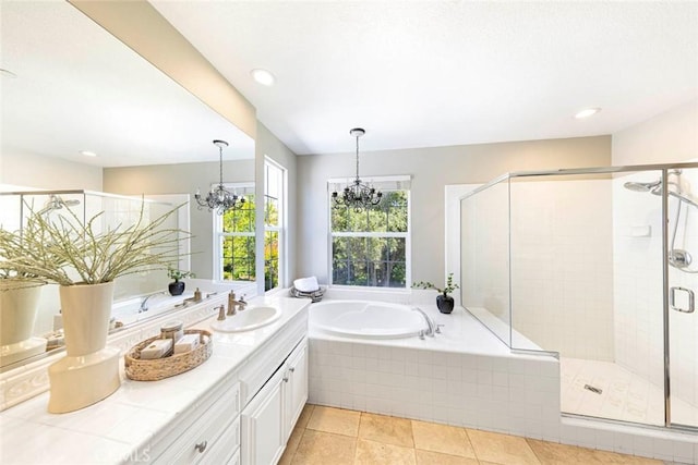 107 Plaza Via Sol, San Clemente, CA 92673 - full bathroom featuring a chandelier, a bath, a stall shower, vanity, and tile patterned floors