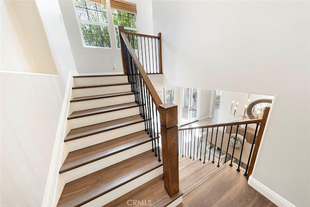 107 Plaza Via Sol, San Clemente, CA 92673 - staircase featuring wood finished floors, a chandelier, and baseboards