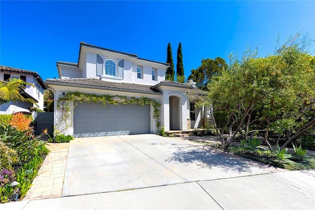 107 Plaza Via Sol, San Clemente, CA 92673 - view of front of property featuring stucco siding, concrete driveway, and a garage