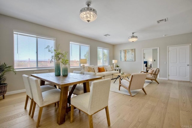 26149 Manzanita St, Murrieta, CA 92563 - dining area with plenty of natural light, light wood-style floors, baseboards, and a chandelier