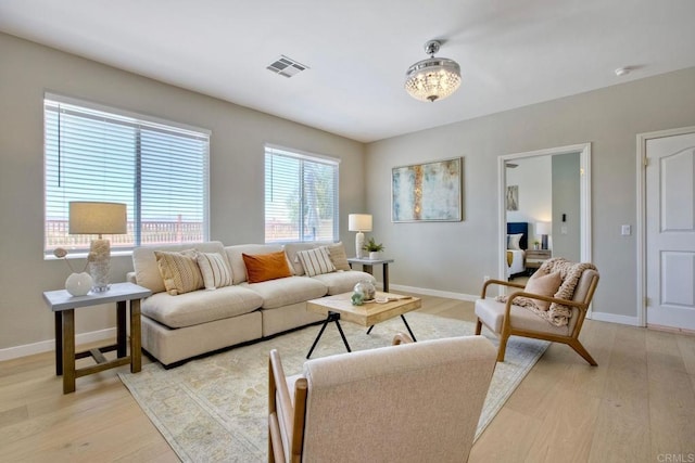 26149 Manzanita St, Murrieta, CA 92563 - living area featuring light wood-style flooring and baseboards