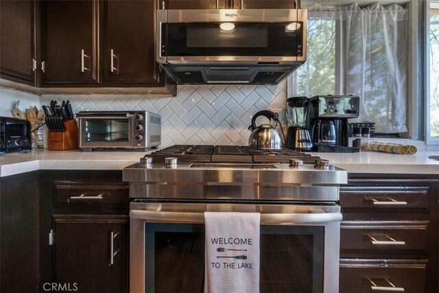 1033 Nadelhorn Dr, Lake Arrowhead, CA 92352 - kitchen featuring stainless steel appliances, dark brown cabinets, light countertops, and backsplash