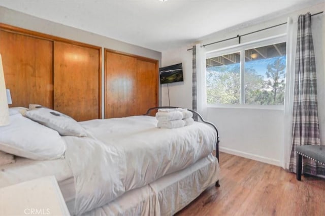 1033 Nadelhorn Dr, Lake Arrowhead, CA 92352 - bedroom featuring light wood-style flooring, baseboards, and multiple closets