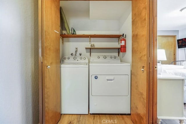 1033 Nadelhorn Dr, Lake Arrowhead, CA 92352 - washroom featuring washing machine and clothes dryer and light wood finished floors