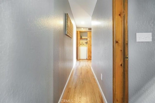 1033 Nadelhorn Dr, Lake Arrowhead, CA 92352 - corridor featuring light wood finished floors, baseboards, and a textured wall