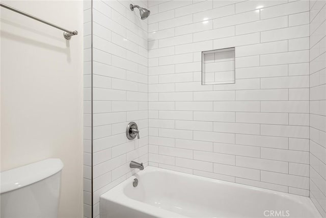 bathroom with toilet and bathtub / shower combination