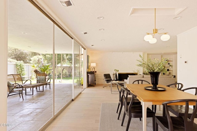 756 Linda Vista Ave, Pasadena, CA 91103 - dining area with a chandelier and light wood-type flooring