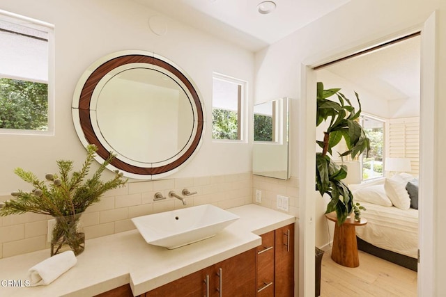 756 Linda Vista Ave, Pasadena, CA 91103 - ensuite bathroom with healthy amount of natural light, wood finished floors, backsplash, and vanity