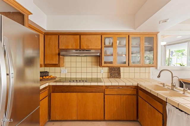 756 Linda Vista Ave, Pasadena, CA 91103 - kitchen featuring freestanding refrigerator, a sink, under cabinet range hood, and decorative backsplash