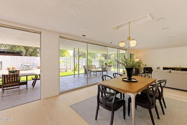 756 Linda Vista Ave, Pasadena, CA 91103 - dining space with light wood-style floors, a textured ceiling, floor to ceiling windows, and recessed lighting