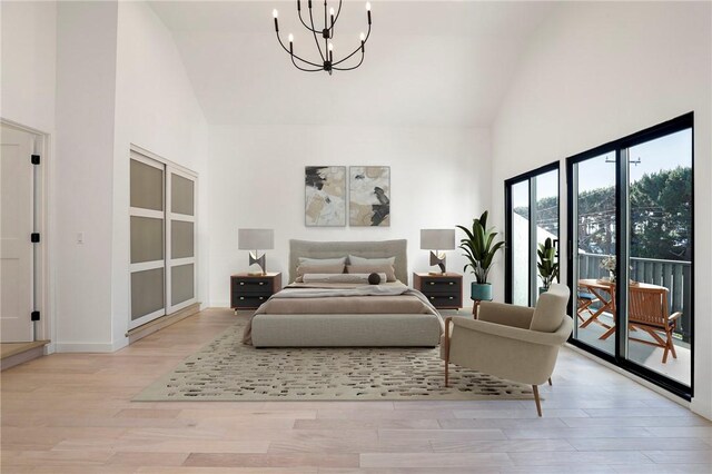 5633 E Deborah St, Long Beach, CA 90815 - bedroom featuring high vaulted ceiling, a chandelier, access to exterior, light wood-style flooring, and baseboards