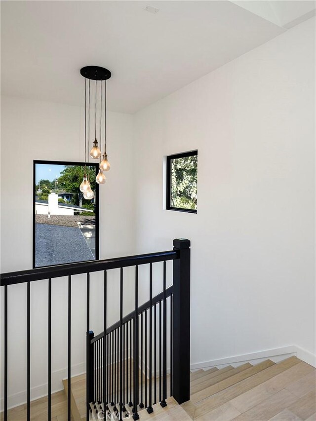 5633 E Deborah St, Long Beach, CA 90815 - stairway featuring wood finished floors, healthy amount of natural light, and baseboards