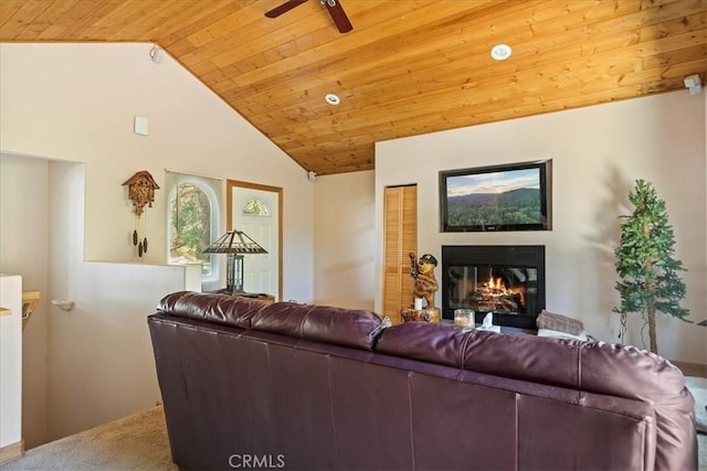 1053 Lausanne Dr, Crestline, CA 92325 - carpeted living area featuring wooden ceiling, a glass covered fireplace, a ceiling fan, and high vaulted ceiling