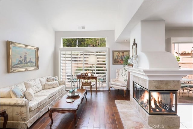 48 Via Athena, Aliso Viejo, CA 92656 - living room featuring hardwood / wood-style floors and a tiled fireplace