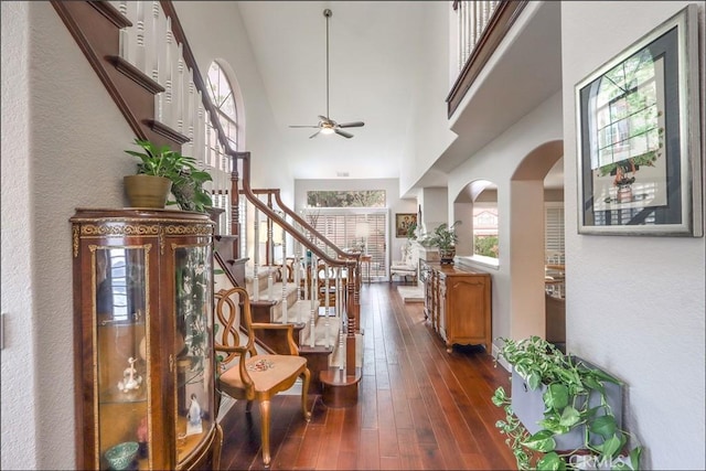 48 Via Athena, Aliso Viejo, CA 92656 - entrance foyer with stairway, dark wood-type flooring, arched walkways, ceiling fan, and a high ceiling