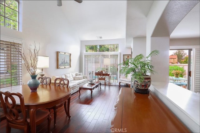 48 Via Athena, Aliso Viejo, CA 92656 - living area featuring dark wood-style flooring, plenty of natural light, a ceiling fan, and a towering ceiling