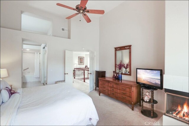 48 Via Athena, Aliso Viejo, CA 92656 - bedroom with light colored carpet, high vaulted ceiling, a fireplace, and ensuite bathroom