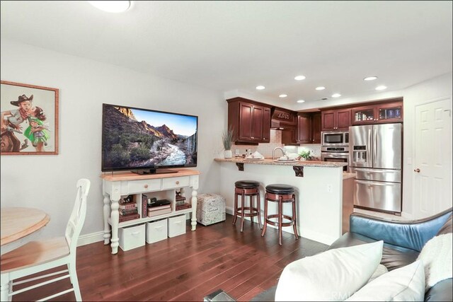 48 Via Athena, Aliso Viejo, CA 92656 - living area with dark wood-type flooring, recessed lighting, and baseboards