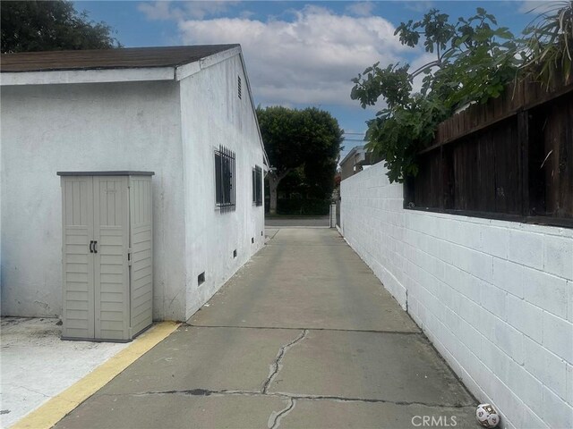 3743 W 112th St, Inglewood, CA 90303 - view of side of home with crawl space and stucco siding