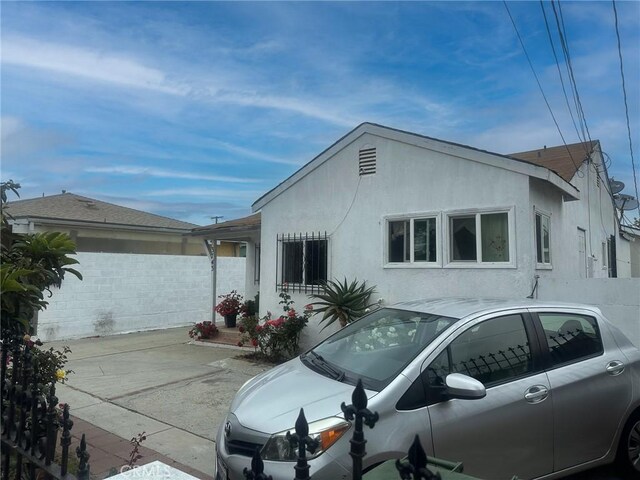 3743 W 112th St, Inglewood, CA 90303 - view of side of property featuring stucco siding and a patio