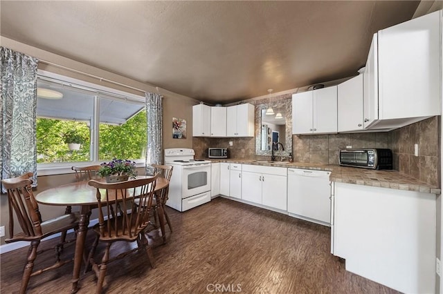 3595 Vista St, Clearlake, CA 95422 - kitchen with white appliances, a sink, dark wood-type flooring, tasteful backsplash, and white cabinets