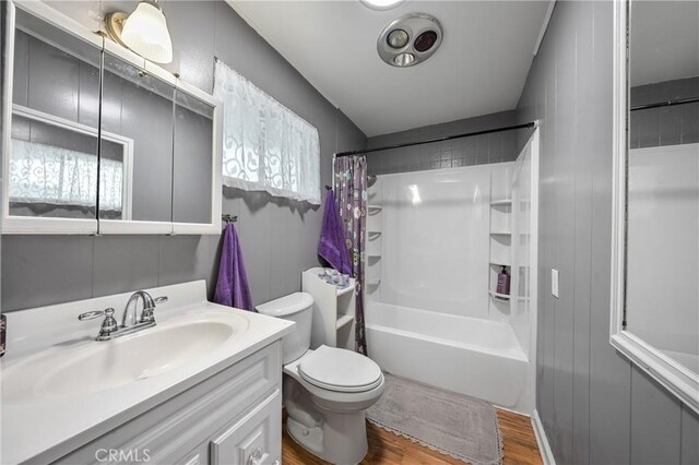 3595 Vista St, Clearlake, CA 95422 - full bath featuring wood finished floors, toilet, vanity, and shower / bathtub combination with curtain
