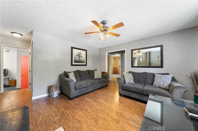 3595 Vista St, Clearlake, CA 95422 - living area featuring a ceiling fan, light wood-type flooring, and a textured ceiling