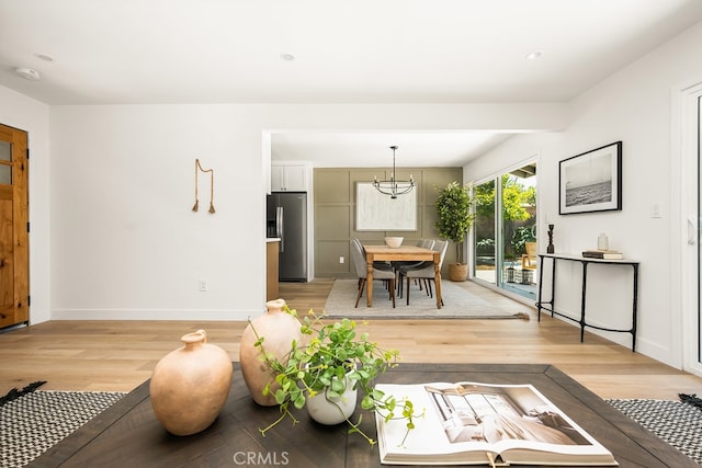 2049 Wickshire Ave, Hacienda Heights, CA 91745 - living room featuring light wood-style flooring, a chandelier, baseboards, and recessed lighting