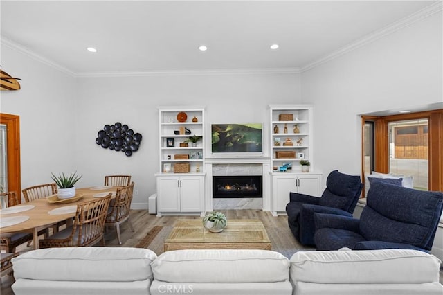 3080 Studio Dr, Cayucos, CA 93430 - living area with light wood-style flooring, ornamental molding, a premium fireplace, recessed lighting, and baseboards