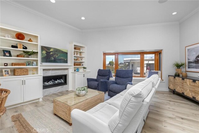 3080 Studio Dr, Cayucos, CA 93430 - living room featuring ornamental molding, light wood finished floors, a high end fireplace, and recessed lighting