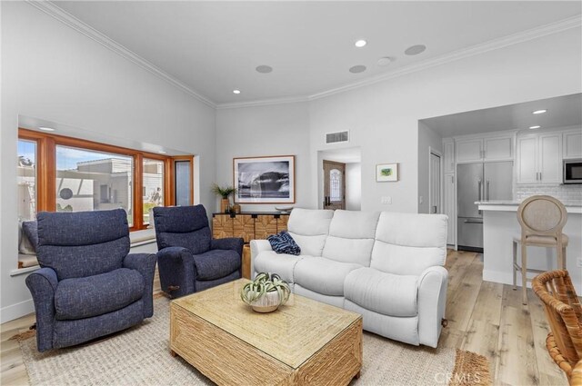 3080 Studio Dr, Cayucos, CA 93430 - living area with ornamental molding, light wood-style floors, and recessed lighting