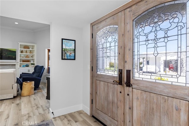 3080 Studio Dr, Cayucos, CA 93430 - foyer featuring crown molding, baseboards, and light wood-style floors