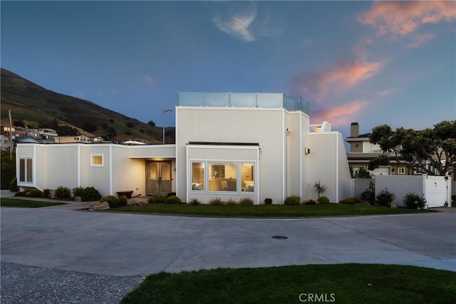 3080 Studio Dr, Cayucos, CA 93430 - back of house at dusk with a mountain view and fence