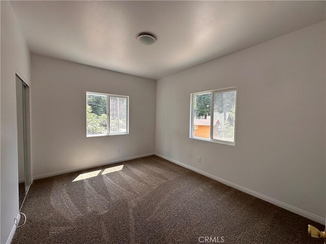 9345 Conifer Dr, Forest Falls, CA 92339 - spare room featuring plenty of natural light and carpet floors