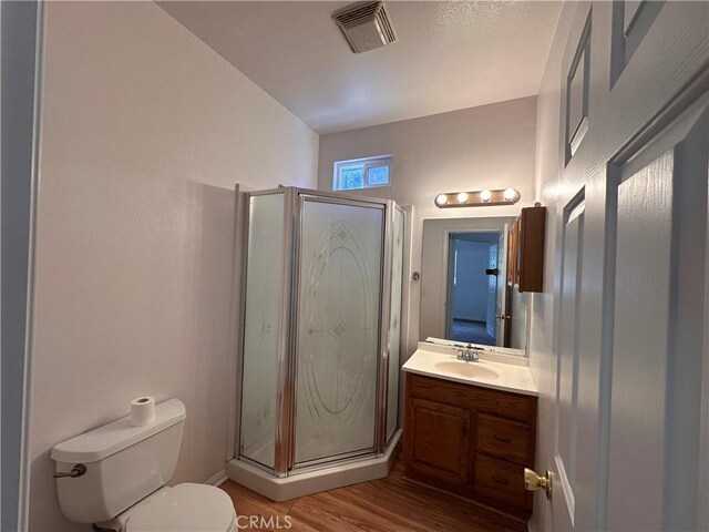 9345 Conifer Dr, Forest Falls, CA 92339 - bathroom featuring vanity, wood finished floors, and a stall shower