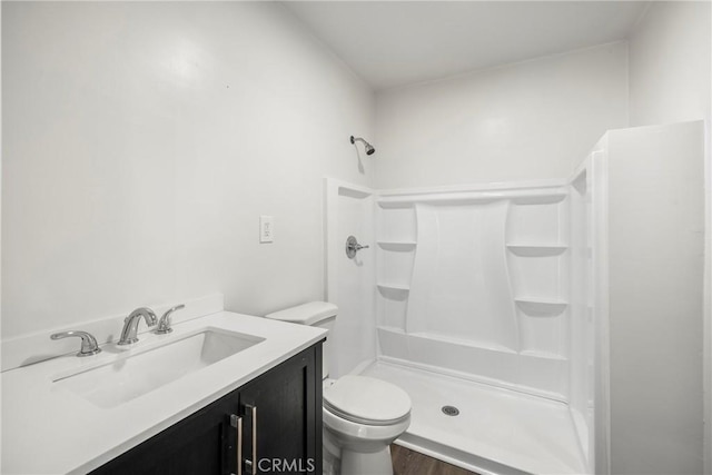 747 W 9th St, San Bernardino, CA 92410 - full bath featuring a stall shower, toilet, vanity, and wood finished floors