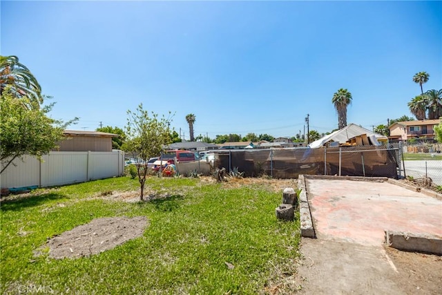 747 W 9th St, San Bernardino, CA 92410 - view of yard with fence and a patio