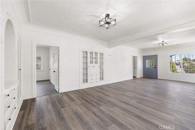 747 W 9th St, San Bernardino, CA 92410 - unfurnished living room with wood finished floors and baseboards