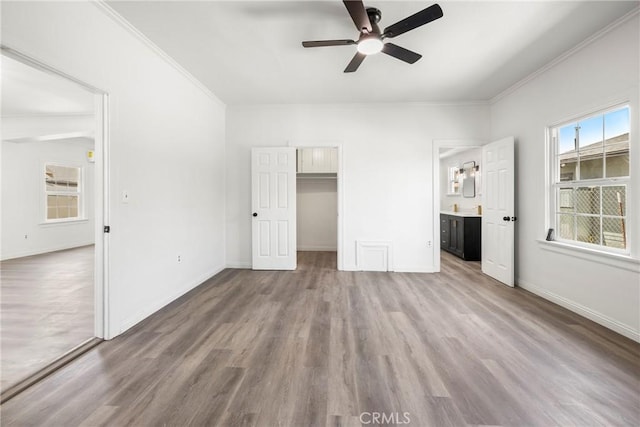 747 W 9th St, San Bernardino, CA 92410 - unfurnished bedroom featuring wood finished floors, ornamental molding, baseboards, ensuite bathroom, and ceiling fan