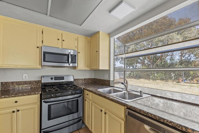 1561 Parkland Way, San Diego, CA 92114 - kitchen featuring stainless steel appliances, plenty of natural light, and cream cabinets