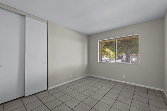 1561 Parkland Way, San Diego, CA 92114 - unfurnished bedroom featuring a closet and light tile patterned flooring