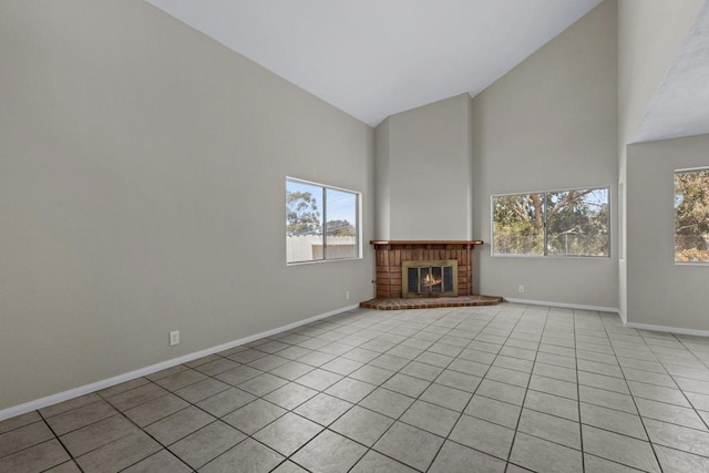 1561 Parkland Way, San Diego, CA 92114 - unfurnished living room with high vaulted ceiling, light tile patterned floors, and a brick fireplace