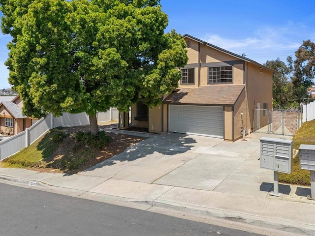 1561 Parkland Way, San Diego, CA 92114 - view of front of home featuring a garage, stucco siding, driveway, and a gate