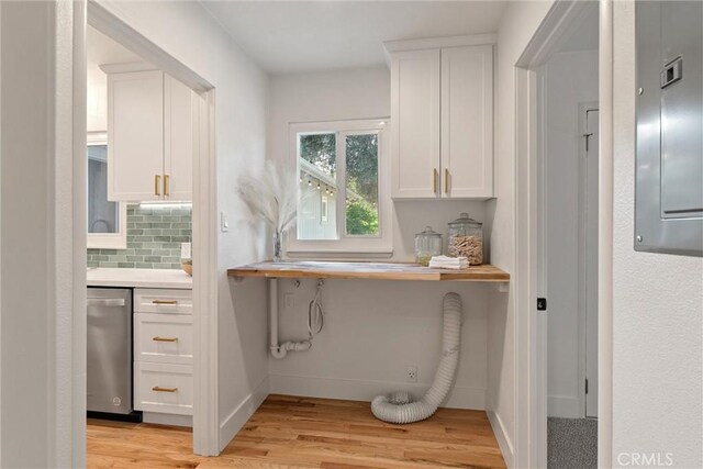 1105 Glenwood Ave, Chico, CA 95926 - kitchen with dishwasher, white cabinets, light wood-type flooring, decorative backsplash, and light countertops