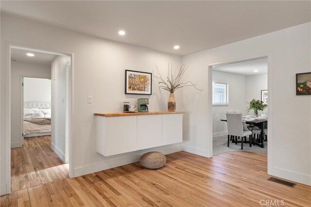 1105 Glenwood Ave, Chico, CA 95926 - hallway with light wood-style floors, recessed lighting, and baseboards